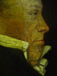 During varnish removal . The black lines all over the face are caused by the way the paint has dried due to poor painting technique