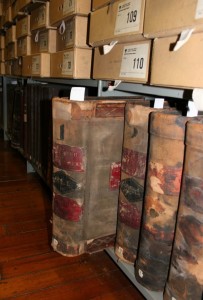 Early share register on a shelf in the Archives storage areas