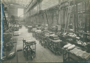 Deserted shell shop with shell bodies loaded onto manual trucks.