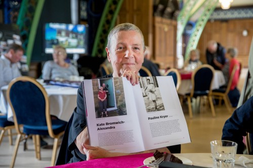 Kate proudly showing her page in the Connections Celebration Book