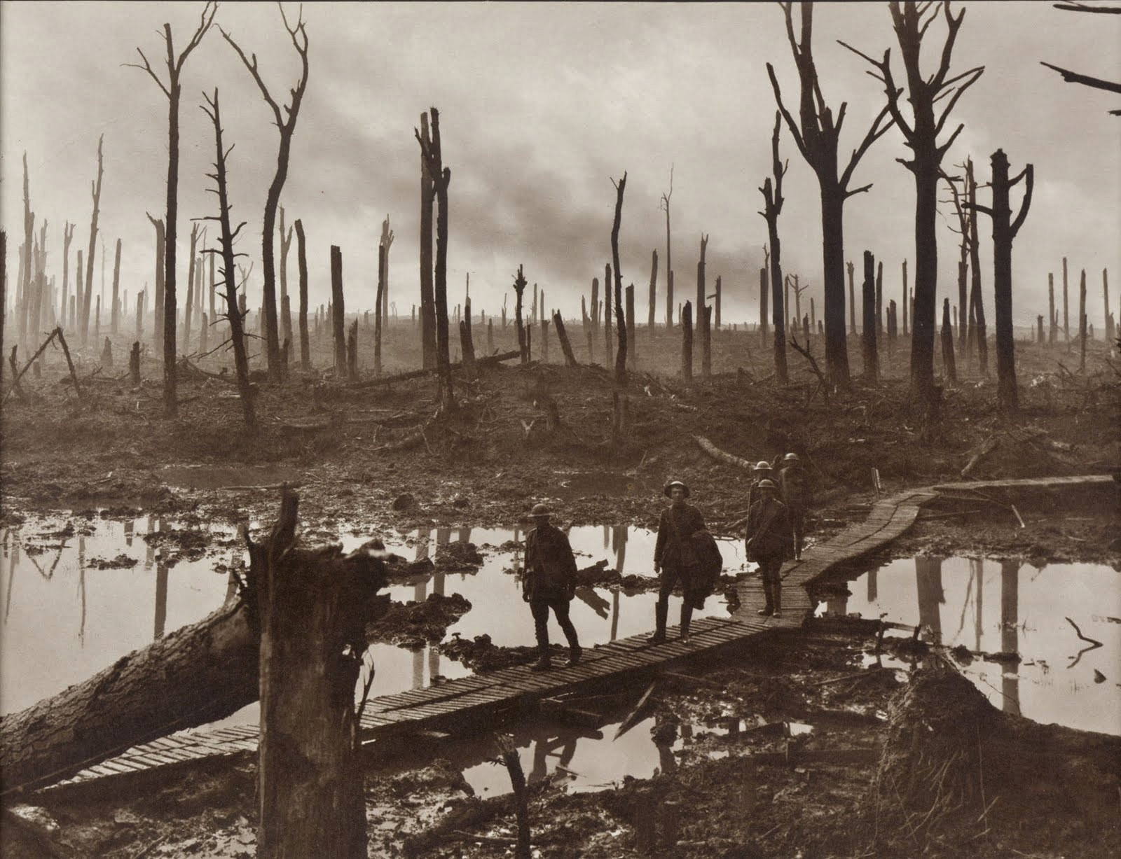 Australian gunners on a duckboard track in Château Wood near Hooge, 29 October 1917. Photo by Frank Hurley. Image: Collection Database of the Australian War Memorial, ID Number: E01220
